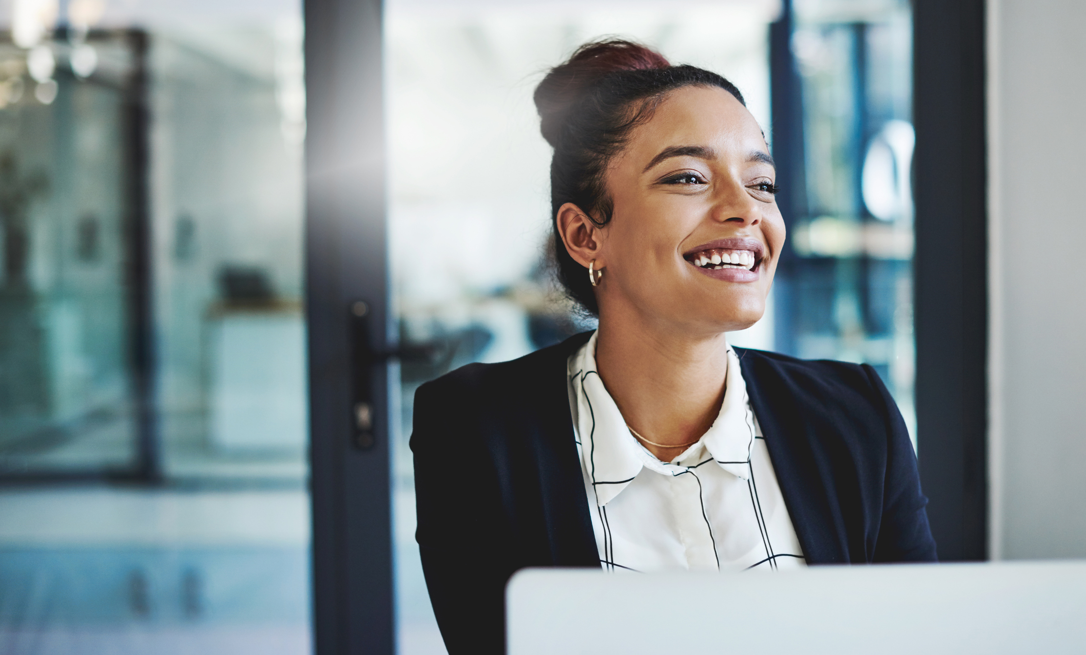 Photo of happy woman in an office