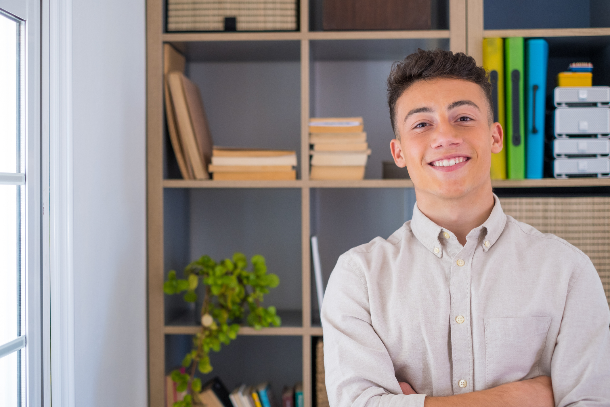 Photo of a young man working in an office.