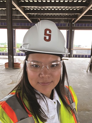 JoAnna_at_Bottleworks Photo of JoAnna with a hard hat at the onsite visit to the new Forvis Mazars office that is under construction