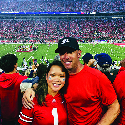 Photo of JoAnna and her husband at an Ohio State football game